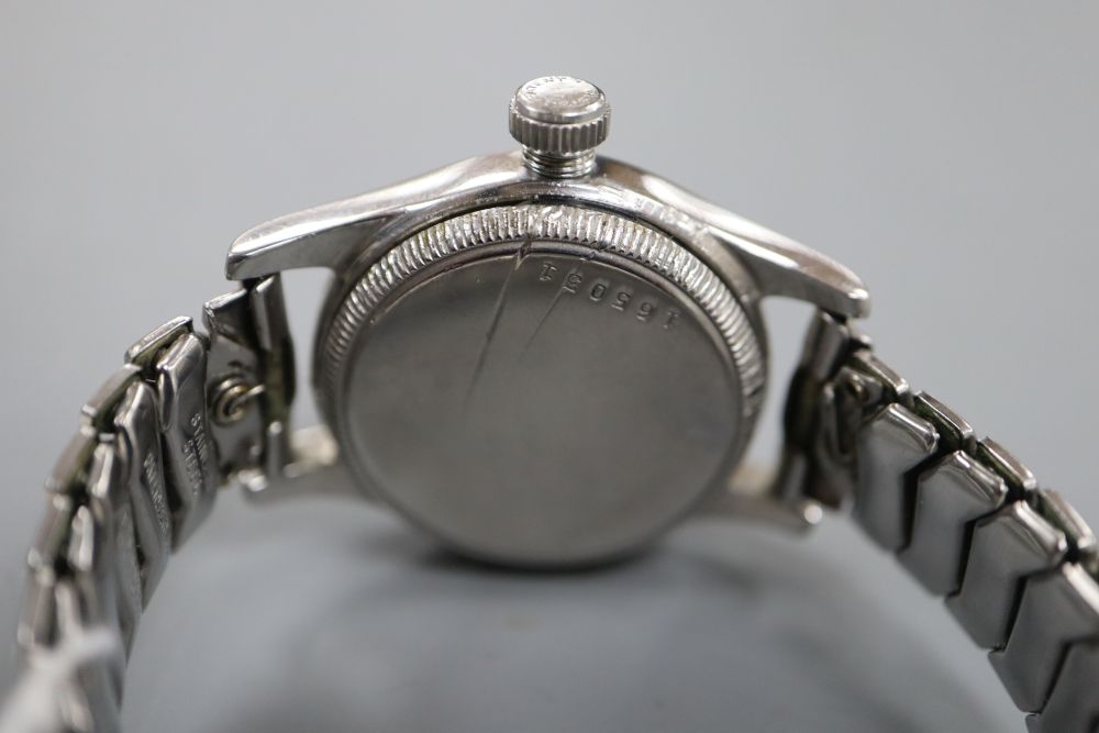 A boys size 1940s stainless steel Oyster Junior Sport manual wind wrist watch, on associated bracelet.